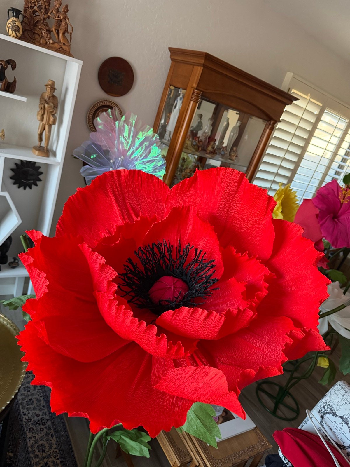 A giant red paper poppy with a dark center